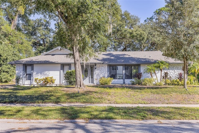 ranch-style house featuring a front lawn