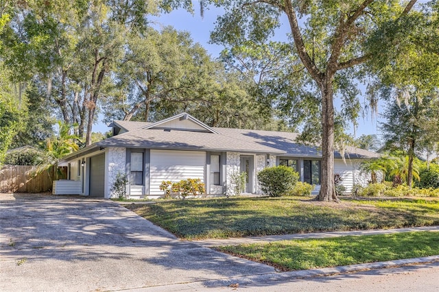 ranch-style home with a front yard