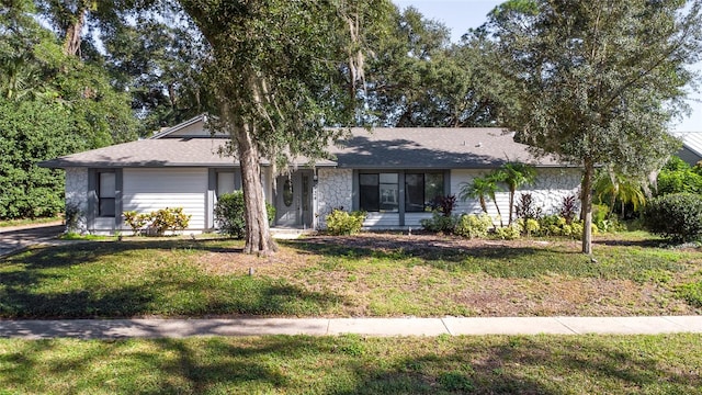 ranch-style home with a front lawn