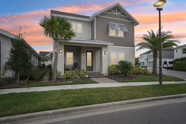 view of front of house with a lawn