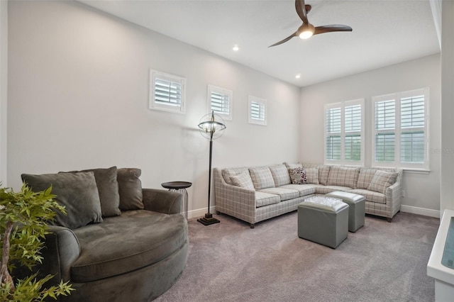 living room with light carpet and ceiling fan