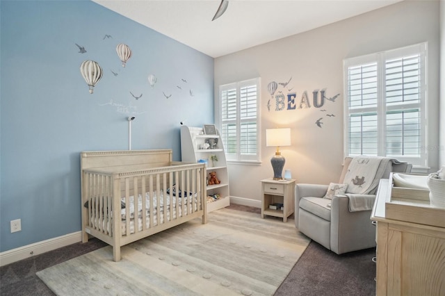 bedroom with carpet floors and a crib