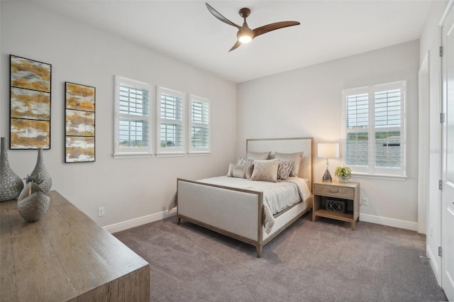 carpeted bedroom with multiple windows and ceiling fan