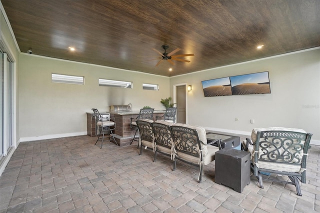 view of patio with ceiling fan and exterior kitchen