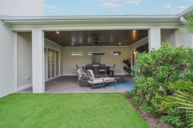 view of patio / terrace featuring ceiling fan