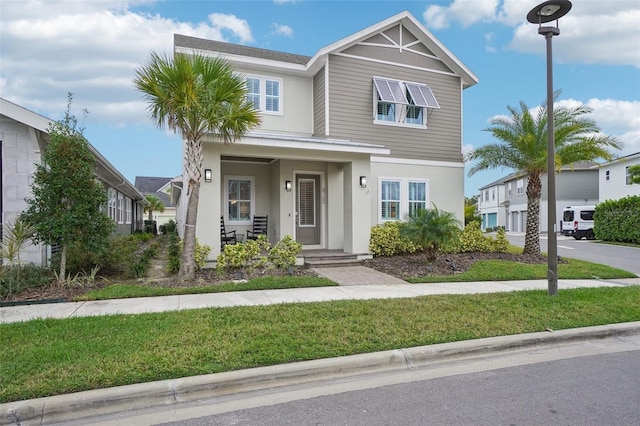 view of front of property featuring a front yard