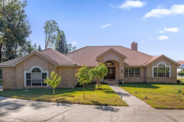 ranch-style house with a front yard