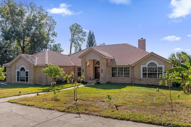 ranch-style home with a front yard