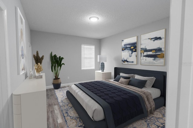 bedroom featuring hardwood / wood-style floors and a textured ceiling