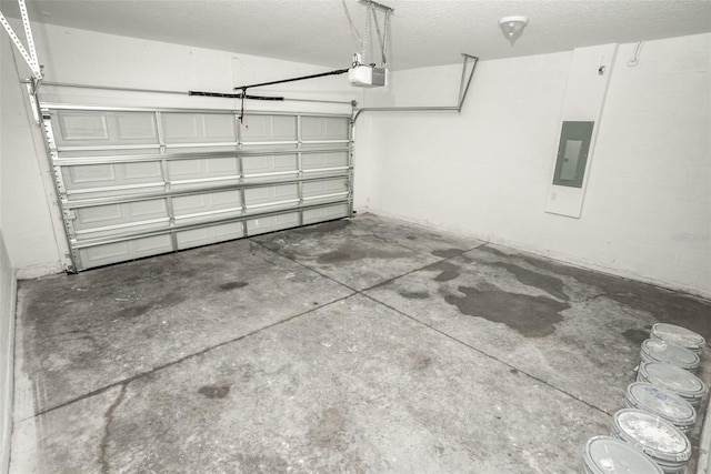 garage featuring electric panel and a garage door opener