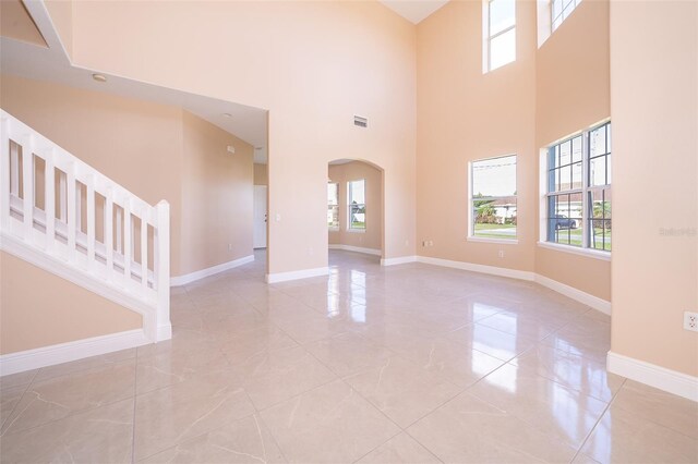 interior space featuring a towering ceiling