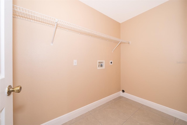 clothes washing area with electric dryer hookup, tile patterned floors, and washer hookup