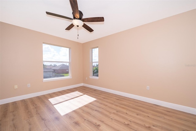 unfurnished room featuring ceiling fan and light wood-type flooring