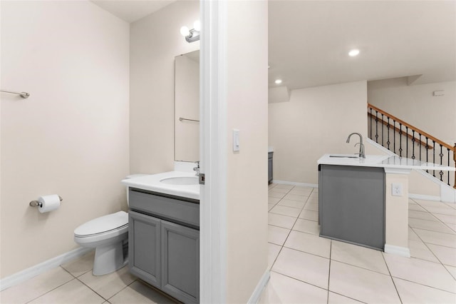 bathroom featuring toilet, vanity, and tile patterned floors