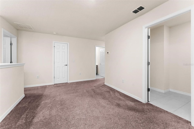 spare room with carpet flooring