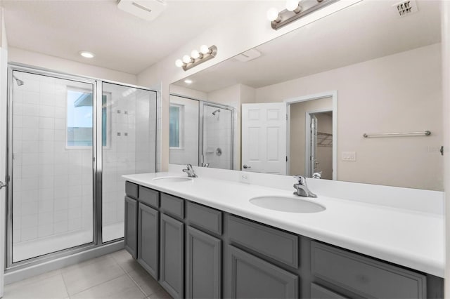 bathroom featuring vanity, tile patterned floors, and an enclosed shower