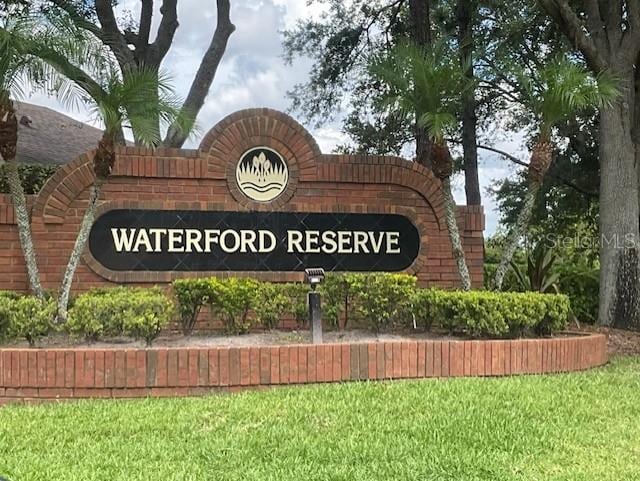 519 Lakescape Ct, Orlando, FL 32828 - community / neighborhood sign featuring a yard