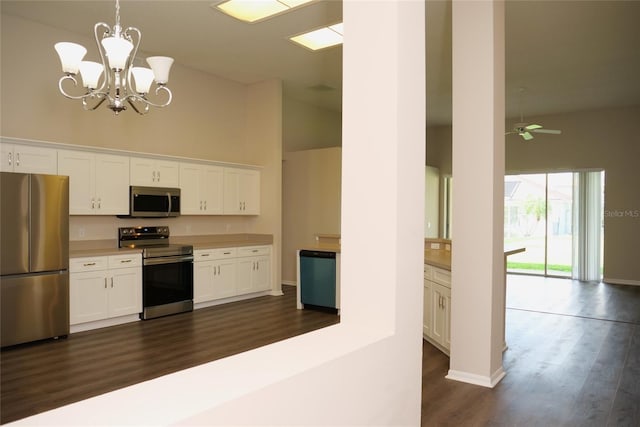 kitchen featuring high vaulted ceiling, dark wood finished floors, white cabinets, and stainless steel appliances