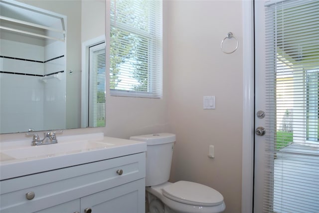 full bath featuring toilet and vanity
