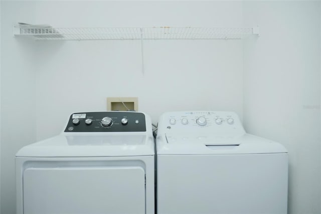 laundry room with independent washer and dryer