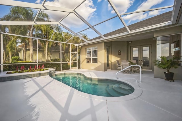 view of swimming pool featuring a patio area, french doors, and glass enclosure