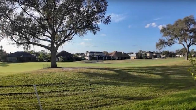 view of property's community with a yard