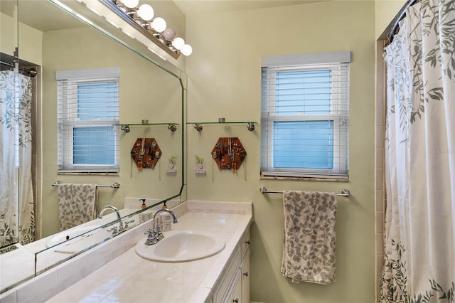 bathroom featuring vanity and walk in shower