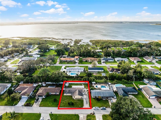 birds eye view of property featuring a water view