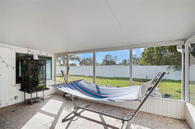 unfurnished sunroom with a wealth of natural light