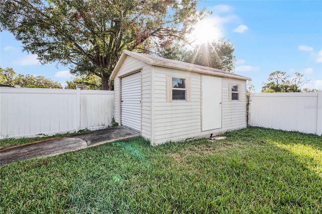 view of outbuilding featuring a lawn