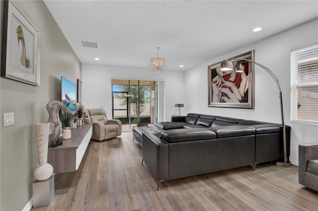 living room with light hardwood / wood-style floors