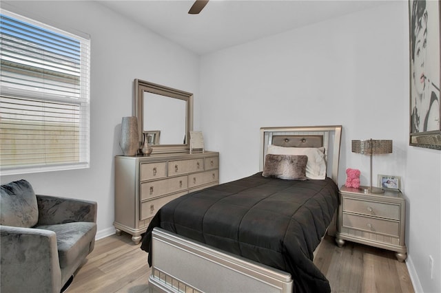 bedroom with ceiling fan and light wood-type flooring