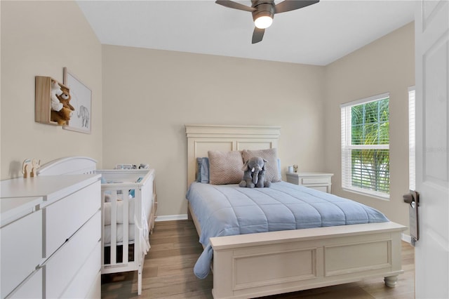 bedroom featuring hardwood / wood-style flooring and ceiling fan