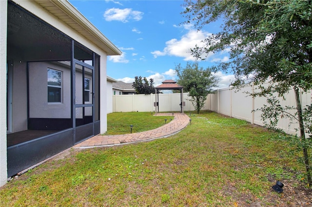 view of yard with a sunroom