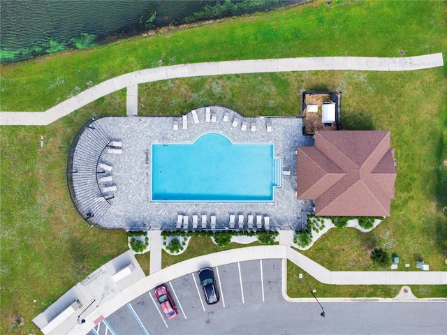 birds eye view of property with a water view