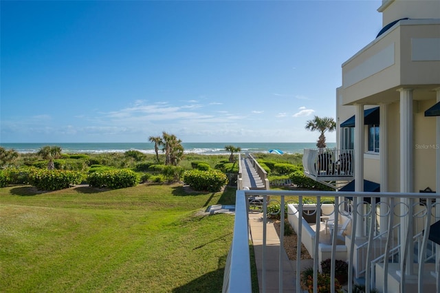 exterior space with a water view and a view of the beach