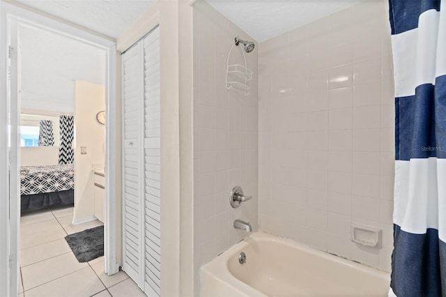 bathroom with tile patterned floors, vanity, and shower / tub combo