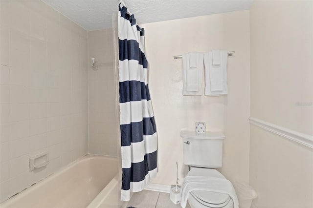 bathroom with shower / bath combination with curtain, a textured ceiling, toilet, and tile patterned floors