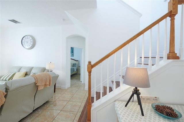 stairs with tile patterned flooring