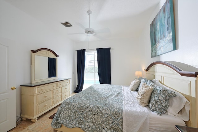 bedroom with ceiling fan and light tile patterned floors