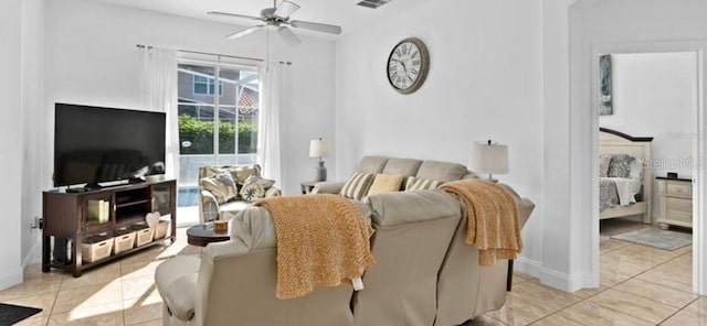 tiled living room featuring ceiling fan