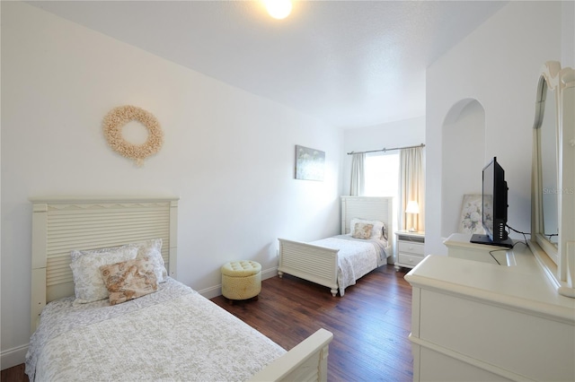 bedroom featuring dark wood-type flooring