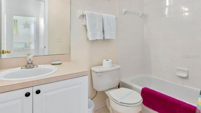 full bathroom featuring vanity, shower / tub combo, and toilet