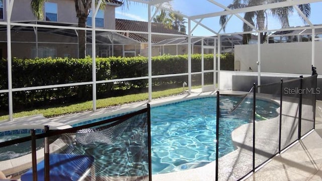 view of pool with a lanai