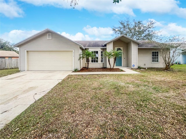 single story home with a front yard and a garage