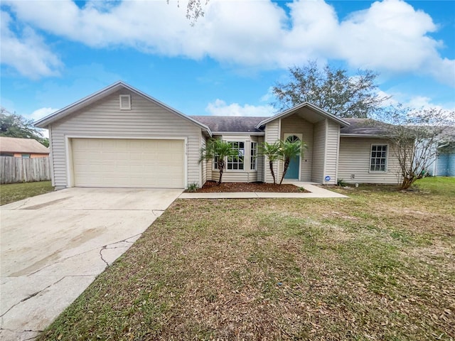 ranch-style home with a front yard and a garage