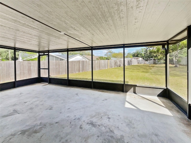 unfurnished sunroom with wooden ceiling