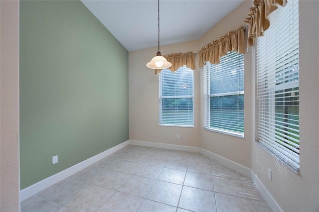 spare room with light tile patterned floors