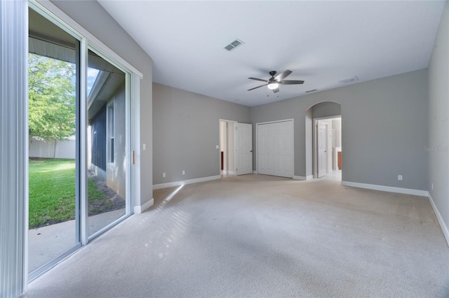 empty room with light colored carpet and ceiling fan