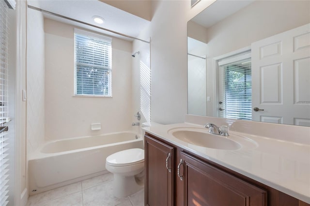 full bathroom with tile patterned flooring, vanity, bathing tub / shower combination, and toilet